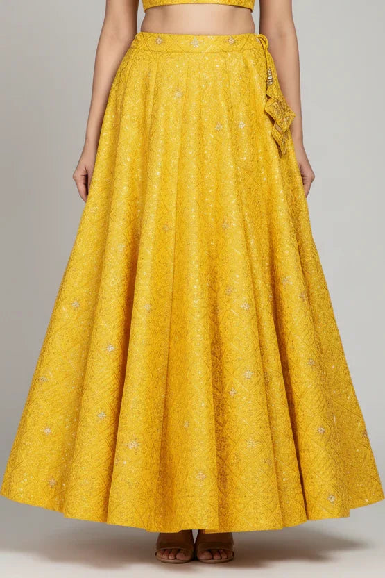 Yellow Indian ethnic embroidered lehenga skirt with subtle golden details from Anandi Fashions