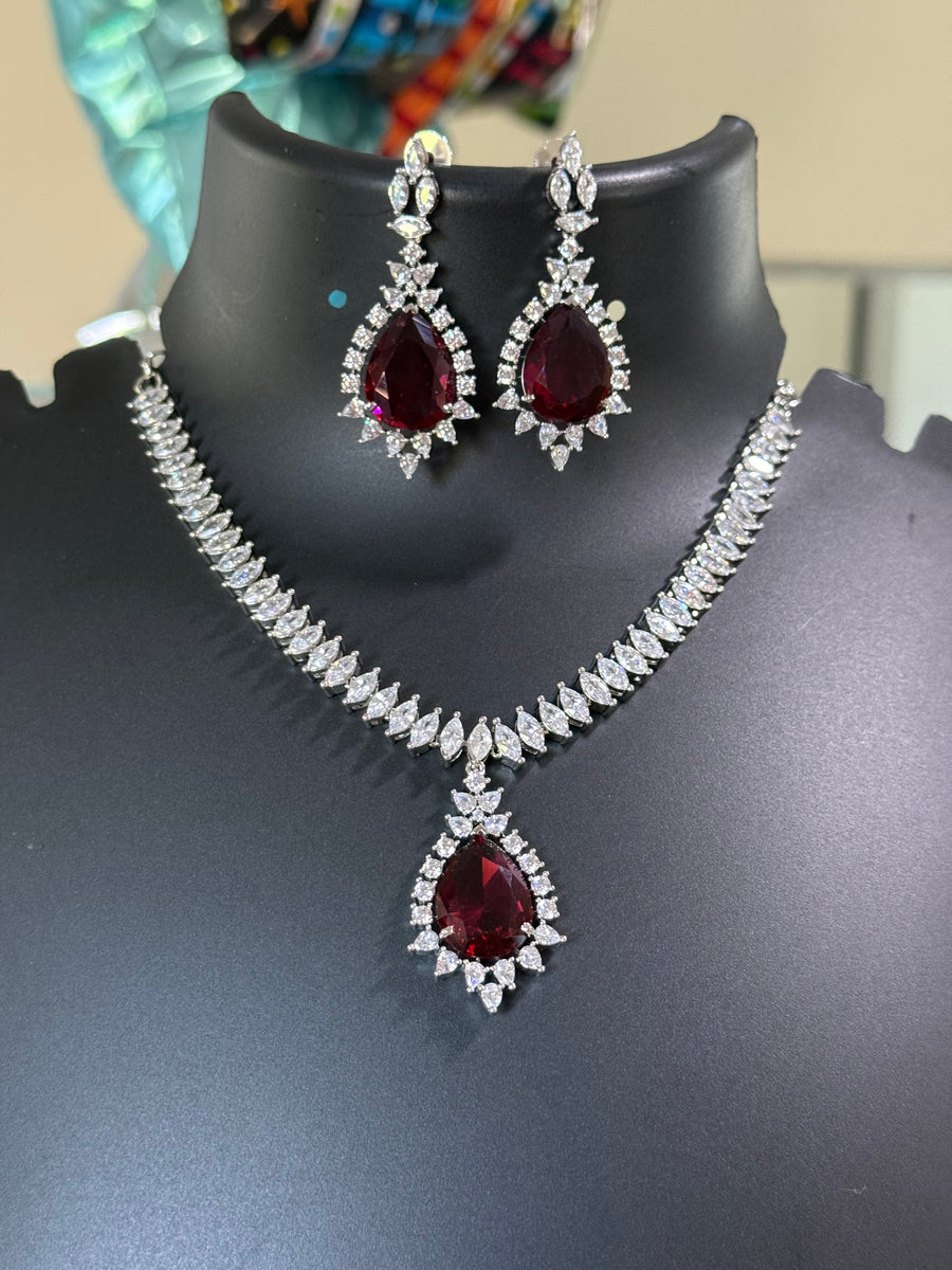 Party Wear Silver Finish Necklace set with Red Stone