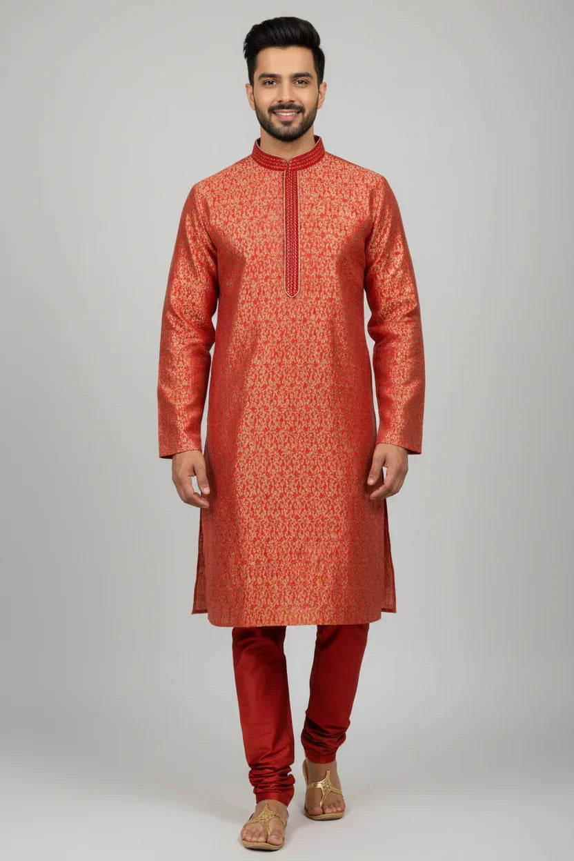 Man wearing traditional red and gold Indian ethnic kurta with churidar pants and sandals