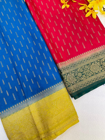 Blue and red Indian sarees with gold zari floral and traditional border designs, displayed on white background with yellow flowers