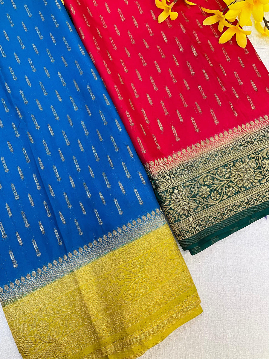 Blue and red Indian sarees with gold zari floral and traditional border designs, displayed on white background with yellow flowers