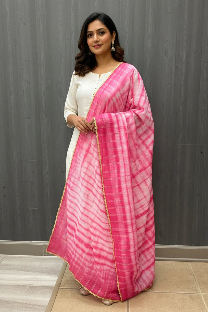 Woman in white ethnic kurta with pink and white tie-dye dupatta, traditional Indian fashion at Anandi Fashions