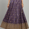 Purple Indian ethnic lehenga skirt with golden floral motifs and intricate border embroidery