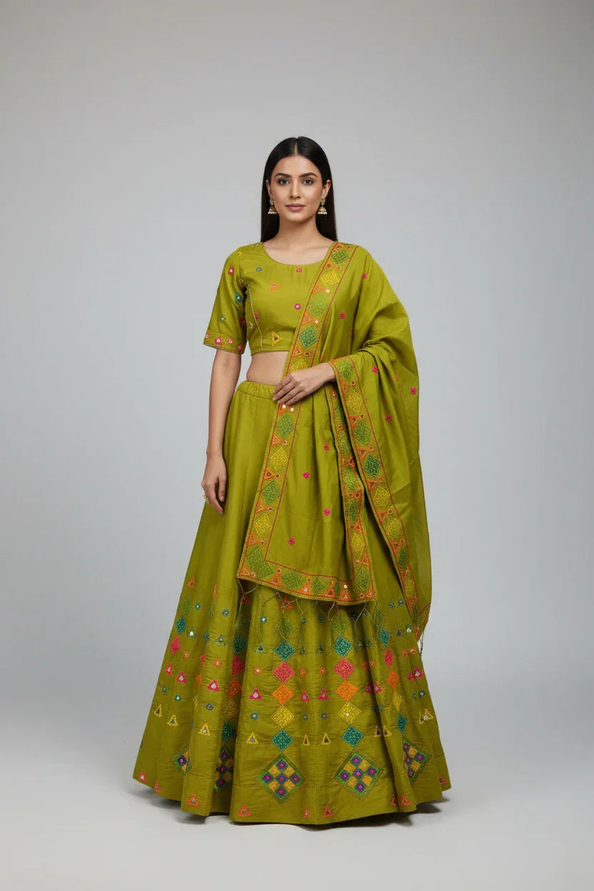Woman modeling olive green Indian ethnic lehenga with multicolored embroidery and matching dupatta