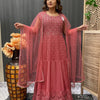 Woman wearing intricately embroidered red Indian ethnic gown with matching sheer dupatta at Anandi Fashions