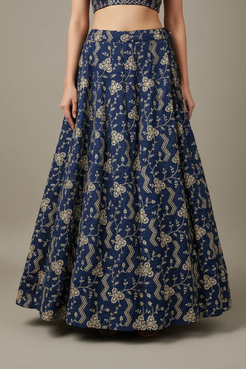 Blue Indian ethnic lehenga skirt with gold floral embroidery, worn with matching blouse