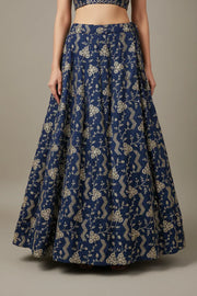 Blue Indian ethnic lehenga skirt with gold floral embroidery, worn with matching blouse