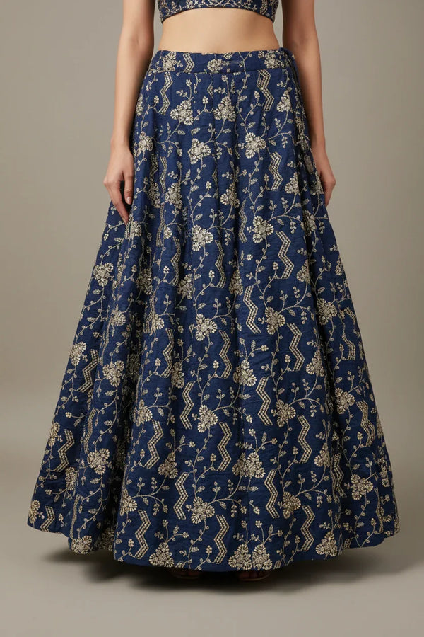 Blue Indian ethnic lehenga skirt with gold floral embroidery, worn with matching blouse