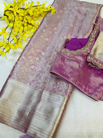 Pink silk Banarasi saree with silver floral zari work, matching blouse with embroidered border, yellow flowers
