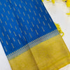 Blue Indian ethnic fabric with golden woven patterns and detailed golden border with tassels