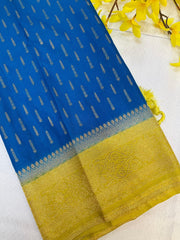 Blue Indian ethnic fabric with golden woven patterns and detailed golden border with tassels
