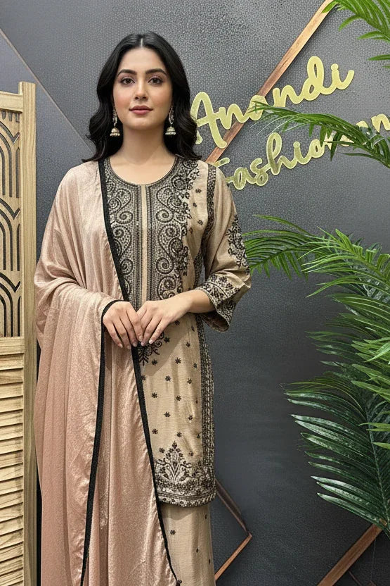 Woman in beige and black embroidered Indian ethnic wear with matching dupatta at Anandi Fashions showroom