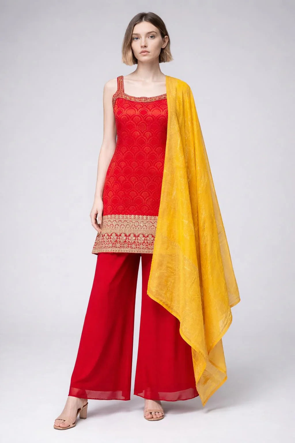 Full body view of the model wearing Red Sleeveless Sharara Set with Gold Zari Work - Premium Party Wear