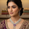 Indian woman wearing purple embroidered saree with gold detailing and diamond necklace and earrings, elegant ethnic jewelry