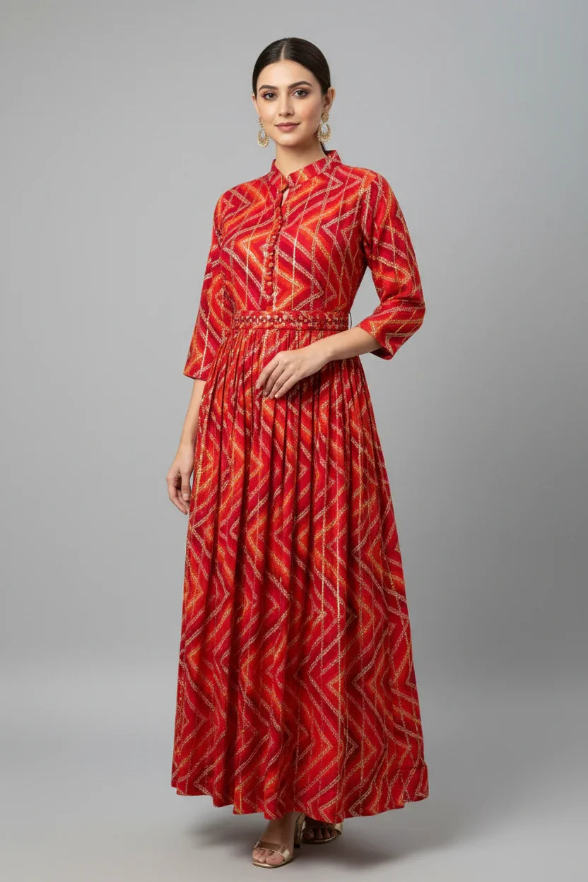 Model wearing a red geometric print Indian ethnic maxi dress with 3-quarter sleeves and embellished waistband